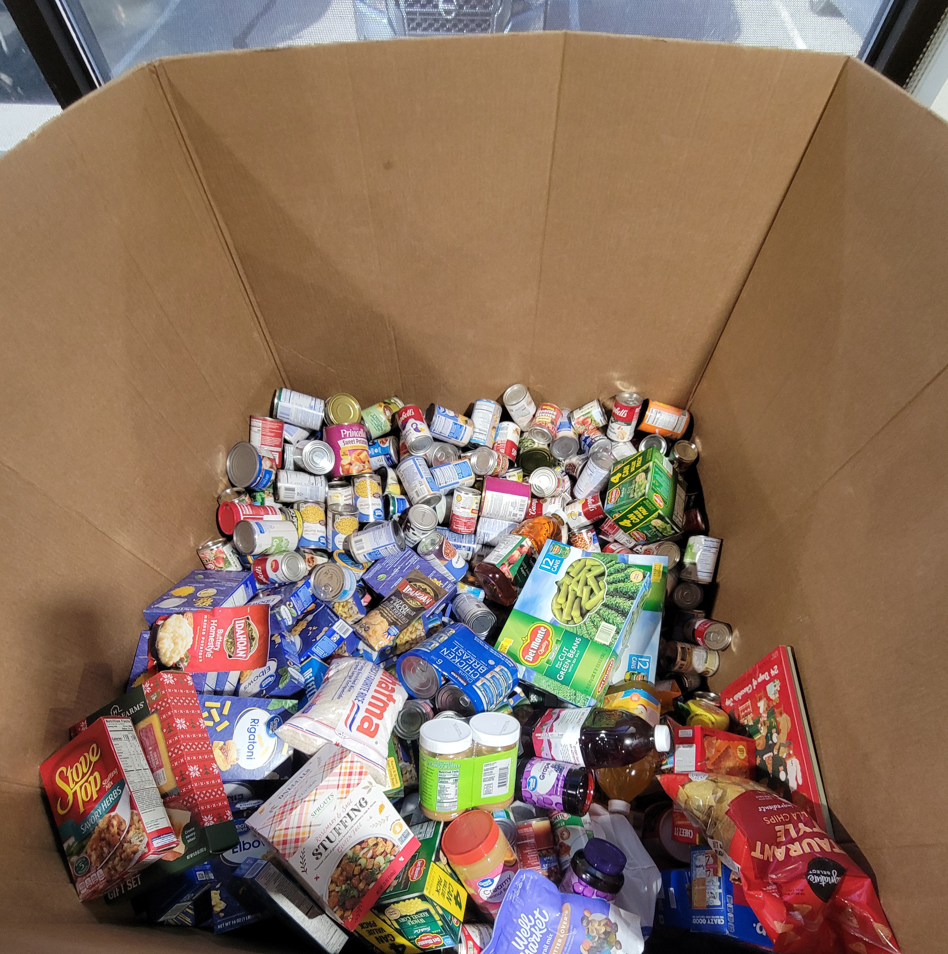 Cardboard container full of dry goods.